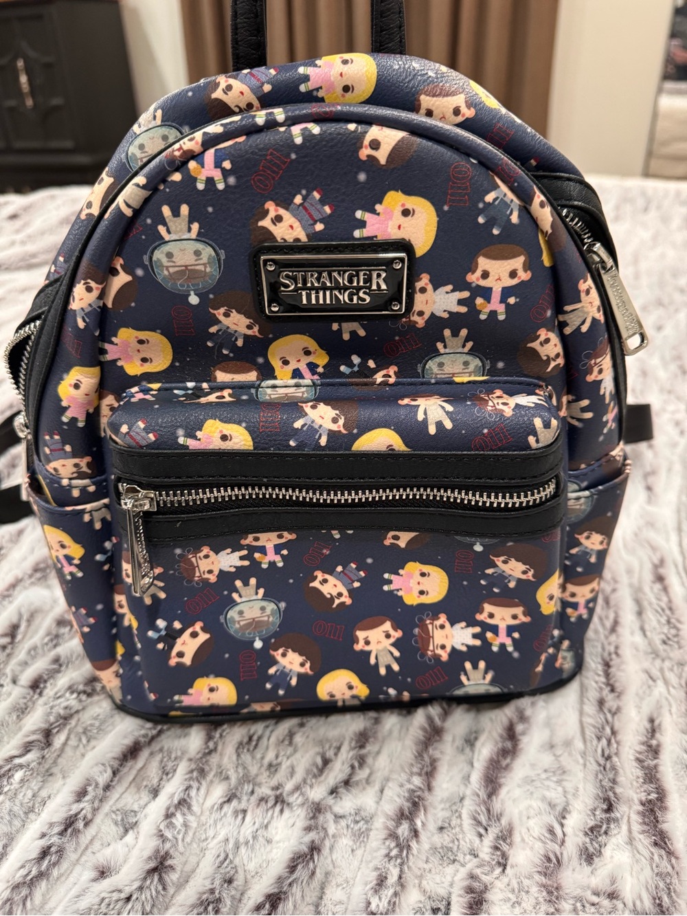 Loungefly Stranger Things Mini Backpack official ST metal logo plate